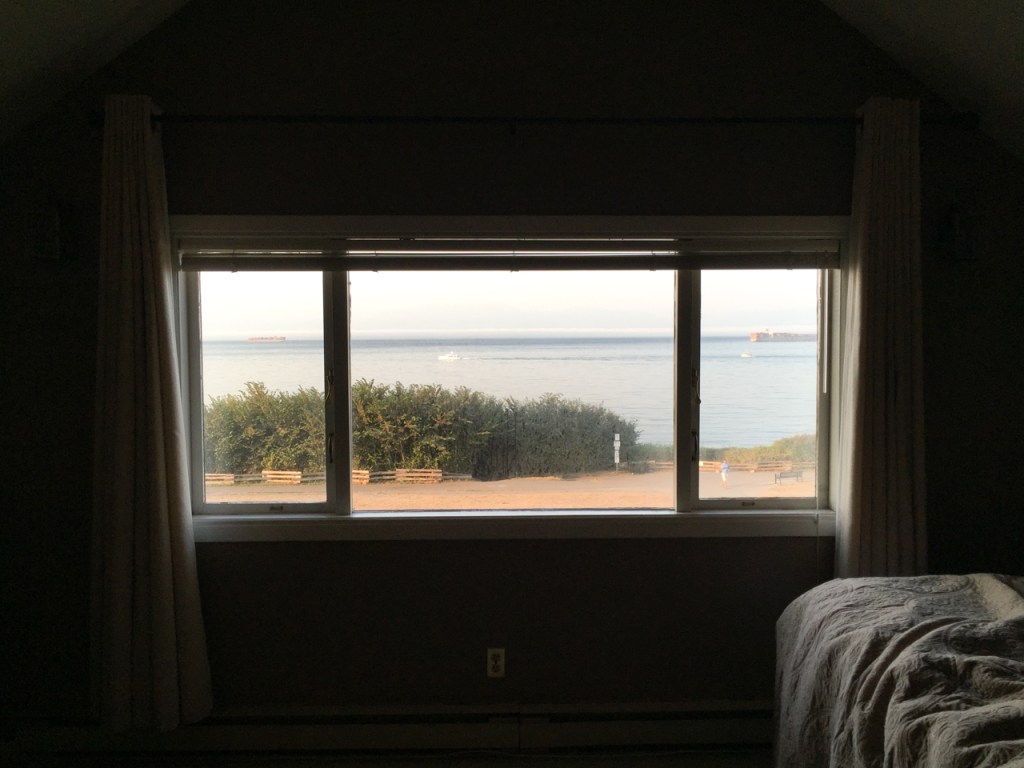 Looking out of the second story window over the waters of the Strait of Juan de Fuca.