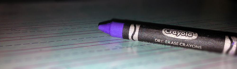 Purple dry-erase crayon on a school-ruled dry-erase board